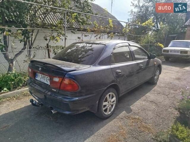Черный Мазда 323, объемом двигателя 1.49 л и пробегом 319 тыс. км за 2400 $, фото 9 на Automoto.ua