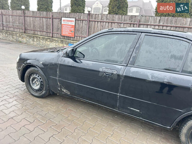 Черный Мазда 323, объемом двигателя 1.6 л и пробегом 215 тыс. км за 2300 $, фото 5 на Automoto.ua