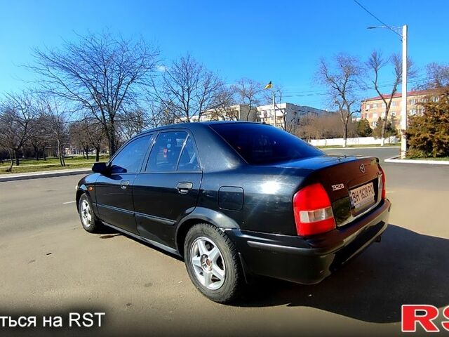 Черный Мазда 323, объемом двигателя 1.8 л и пробегом 384 тыс. км за 2500 $, фото 11 на Automoto.ua