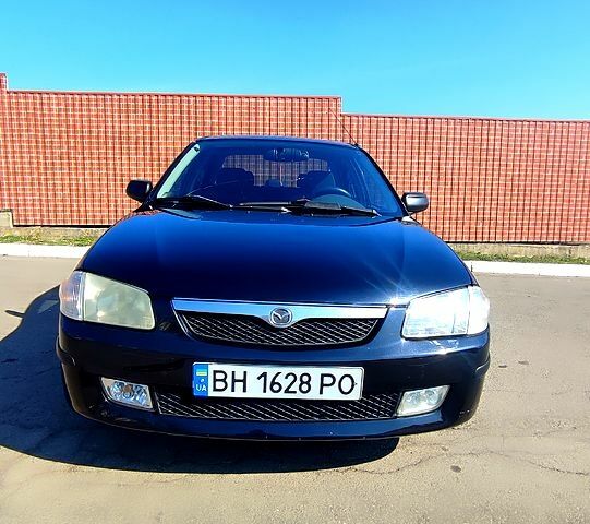 Черный Мазда 323, объемом двигателя 1.8 л и пробегом 384 тыс. км за 2500 $, фото 12 на Automoto.ua