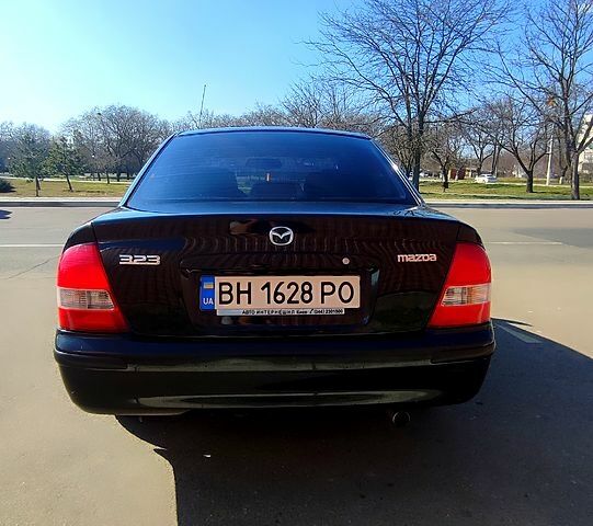 Черный Мазда 323, объемом двигателя 1.8 л и пробегом 384 тыс. км за 2500 $, фото 13 на Automoto.ua