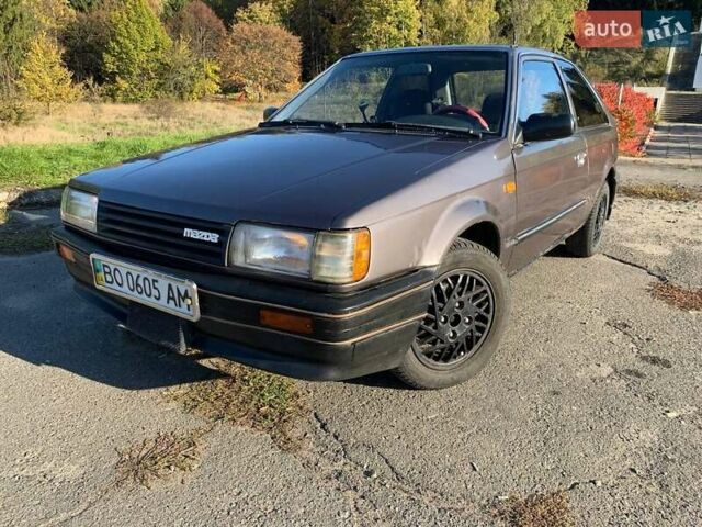 Коричневый Мазда 323, объемом двигателя 1.3 л и пробегом 475 тыс. км за 1300 $, фото 8 на Automoto.ua