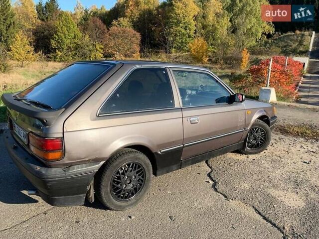 Коричневый Мазда 323, объемом двигателя 1.3 л и пробегом 475 тыс. км за 1300 $, фото 12 на Automoto.ua