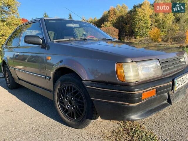 Коричневый Мазда 323, объемом двигателя 1.3 л и пробегом 475 тыс. км за 1300 $, фото 15 на Automoto.ua