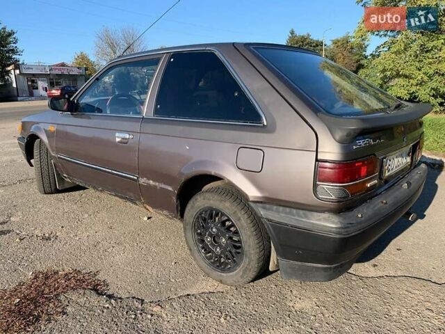 Коричневый Мазда 323, объемом двигателя 1.3 л и пробегом 475 тыс. км за 1300 $, фото 10 на Automoto.ua