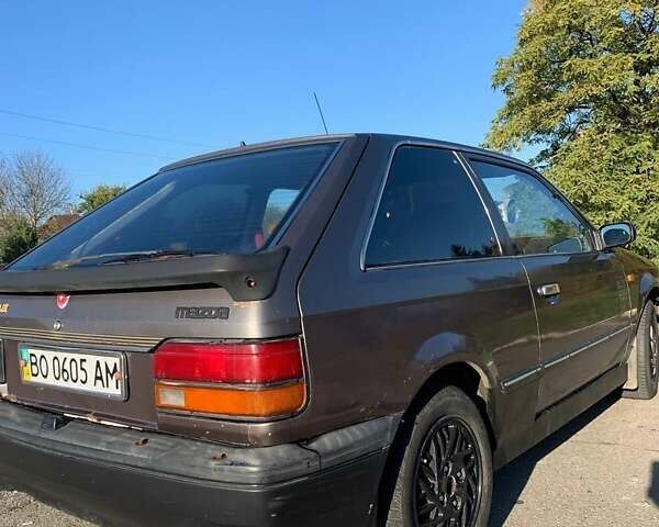 Коричневый Мазда 323, объемом двигателя 1.3 л и пробегом 475 тыс. км за 1300 $, фото 6 на Automoto.ua
