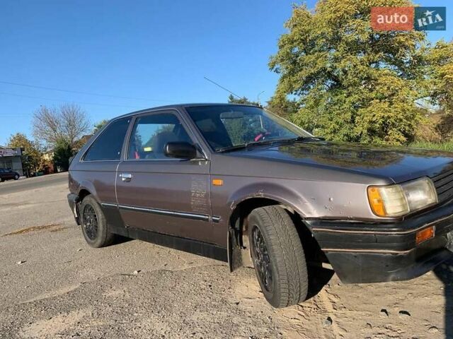 Коричневый Мазда 323, объемом двигателя 1.3 л и пробегом 475 тыс. км за 1300 $, фото 9 на Automoto.ua