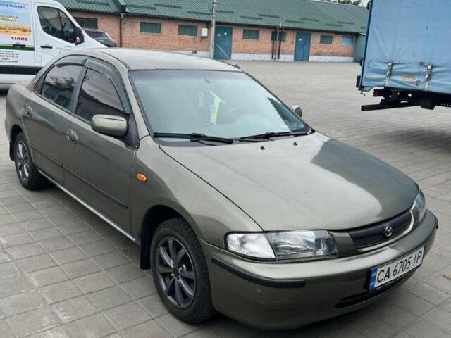 Коричневый Мазда 323, объемом двигателя 1.6 л и пробегом 199 тыс. км за 2400 $, фото 3 на Automoto.ua