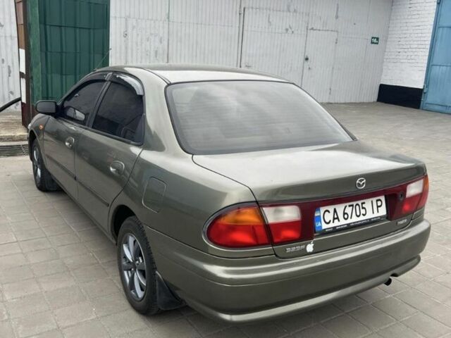 Коричневый Мазда 323, объемом двигателя 1.6 л и пробегом 199 тыс. км за 2400 $, фото 1 на Automoto.ua