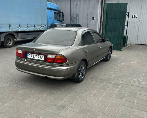 Коричневый Мазда 323, объемом двигателя 1.6 л и пробегом 199 тыс. км за 2600 $, фото 3 на Automoto.ua