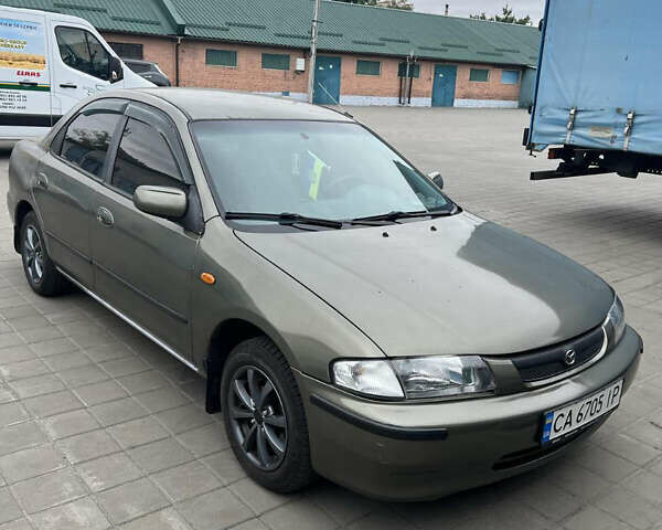 Коричневый Мазда 323, объемом двигателя 1.6 л и пробегом 199 тыс. км за 2600 $, фото 2 на Automoto.ua