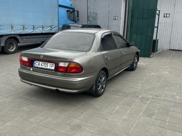 Коричневый Мазда 323, объемом двигателя 1.6 л и пробегом 199 тыс. км за 2400 $, фото 2 на Automoto.ua
