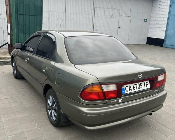 Коричневый Мазда 323, объемом двигателя 1.6 л и пробегом 199 тыс. км за 2600 $, фото 1 на Automoto.ua