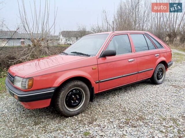 Червоний Мазда 323, об'ємом двигуна 1.3 л та пробігом 250 тис. км за 950 $, фото 1 на Automoto.ua