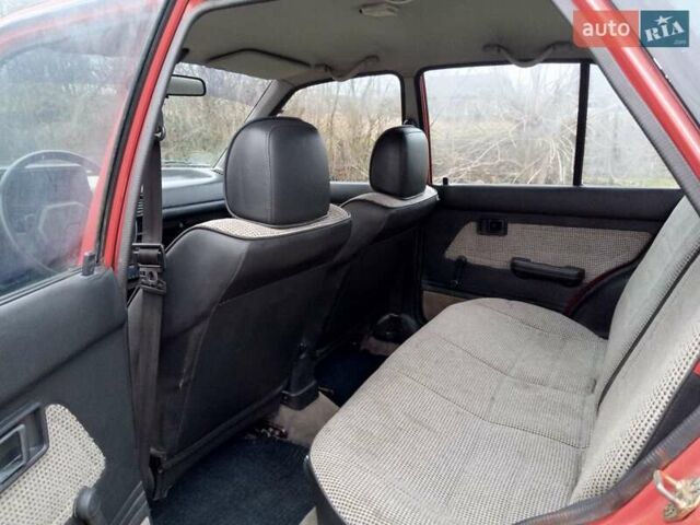 Червоний Мазда 323, об'ємом двигуна 1.3 л та пробігом 250 тис. км за 950 $, фото 10 на Automoto.ua