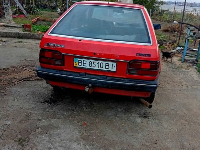 Красный Мазда 323, объемом двигателя 1.7 л и пробегом 370 тыс. км за 450 $, фото 1 на Automoto.ua