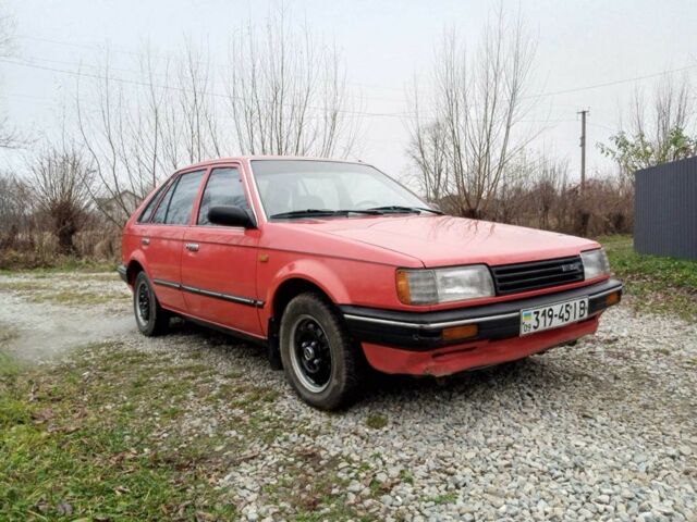 Червоний Мазда 323, об'ємом двигуна 1.3 л та пробігом 250 тис. км за 950 $, фото 6 на Automoto.ua