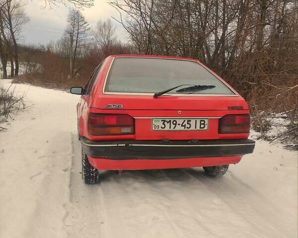 Красный Мазда 323, объемом двигателя 1.3 л и пробегом 250 тыс. км за 1200 $, фото 3 на Automoto.ua
