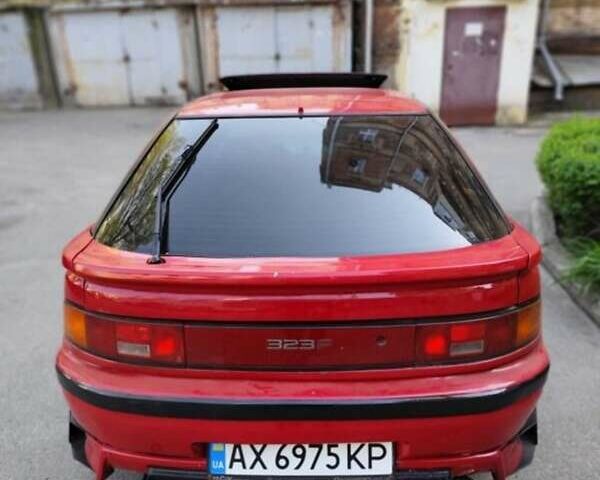 Червоний Мазда 323, об'ємом двигуна 1.8 л та пробігом 264 тис. км за 3000 $, фото 6 на Automoto.ua