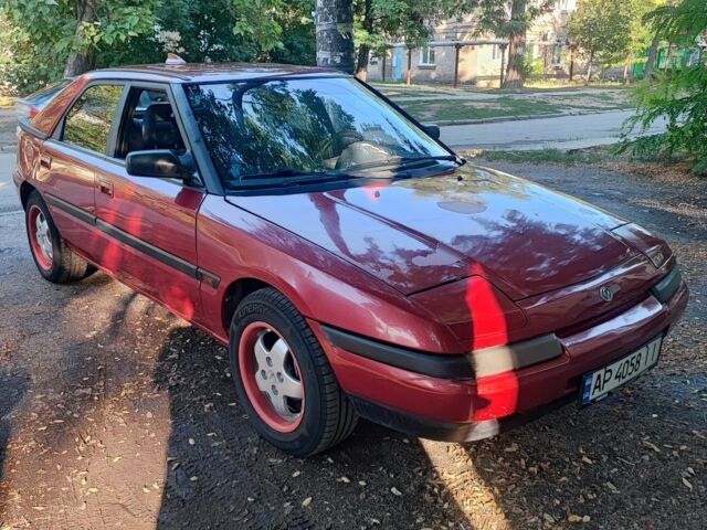 Красный Мазда 323, объемом двигателя 1.8 л и пробегом 444 тыс. км за 1200 $, фото 2 на Automoto.ua