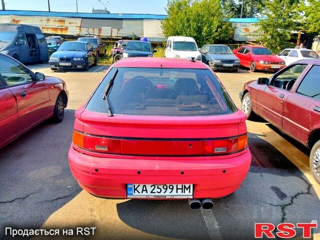 Красный Мазда 323, объемом двигателя 1.8 л и пробегом 143 тыс. км за 1650 $, фото 2 на Automoto.ua