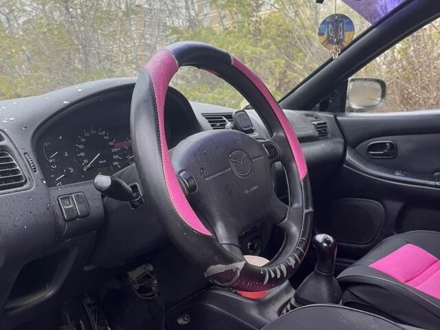 Красный Мазда 323, объемом двигателя 1.5 л и пробегом 323 тыс. км за 1100 $, фото 9 на Automoto.ua