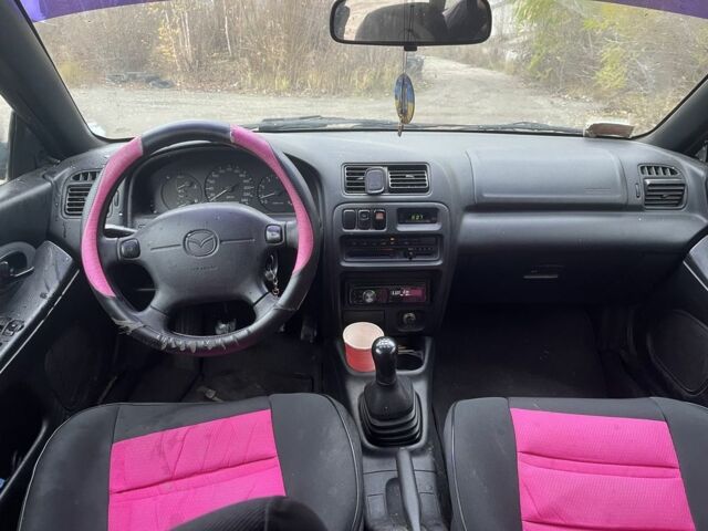 Красный Мазда 323, объемом двигателя 1.5 л и пробегом 323 тыс. км за 1100 $, фото 12 на Automoto.ua