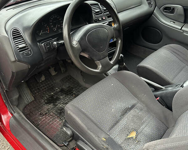 Красный Мазда 323, объемом двигателя 1.49 л и пробегом 450 тыс. км за 2000 $, фото 10 на Automoto.ua