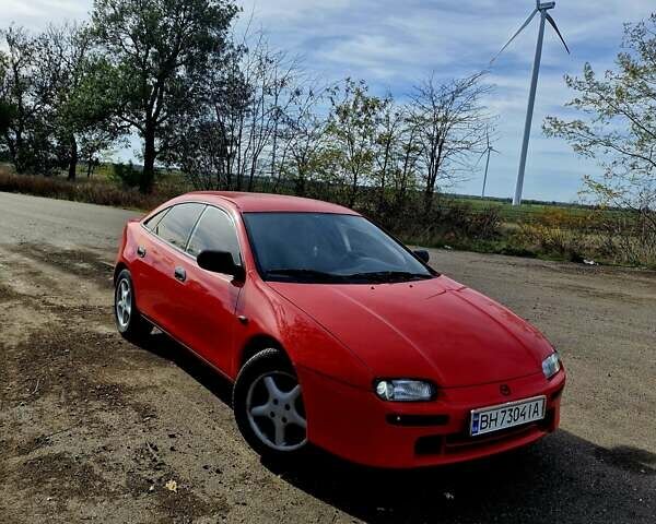 Красный Мазда 323, объемом двигателя 1.84 л и пробегом 303 тыс. км за 2650 $, фото 1 на Automoto.ua