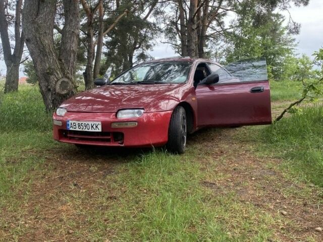 Красный Мазда 323, объемом двигателя 1.5 л и пробегом 639 тыс. км за 2100 $, фото 1 на Automoto.ua