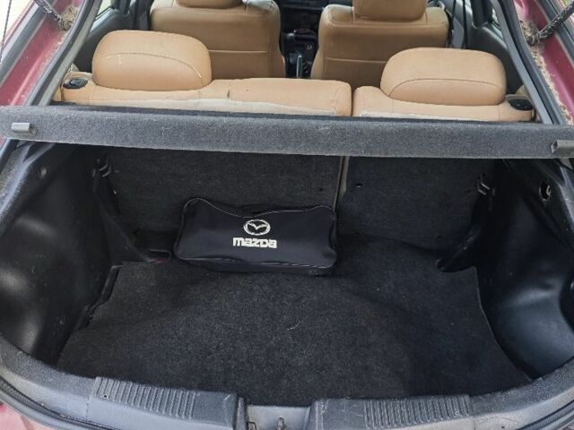 Червоний Мазда 323, об'ємом двигуна 1.5 л та пробігом 500 тис. км за 1000 $, фото 18 на Automoto.ua