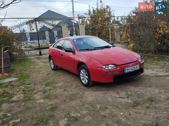 Красный Мазда 323, объемом двигателя 1.5 л и пробегом 258 тыс. км за 1600 $, фото 9 на Automoto.ua