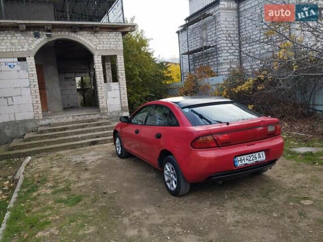 Красный Мазда 323, объемом двигателя 1.5 л и пробегом 258 тыс. км за 1600 $, фото 7 на Automoto.ua