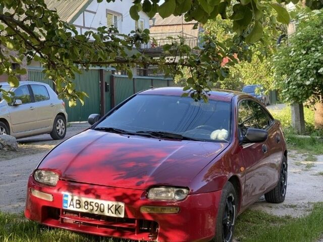 Красный Мазда 323, объемом двигателя 1.5 л и пробегом 639 тыс. км за 2100 $, фото 3 на Automoto.ua