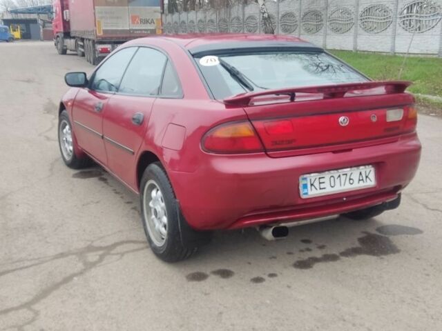 Красный Мазда 323, объемом двигателя 1.5 л и пробегом 367 тыс. км за 2400 $, фото 2 на Automoto.ua