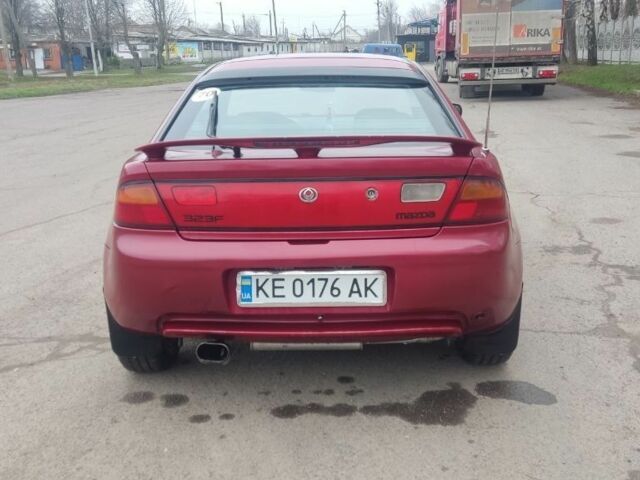Красный Мазда 323, объемом двигателя 1.5 л и пробегом 367 тыс. км за 2400 $, фото 3 на Automoto.ua