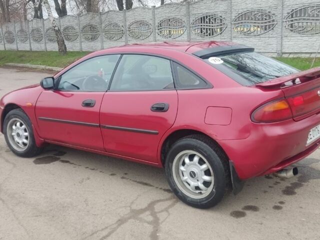 Красный Мазда 323, объемом двигателя 1.5 л и пробегом 367 тыс. км за 2400 $, фото 1 на Automoto.ua