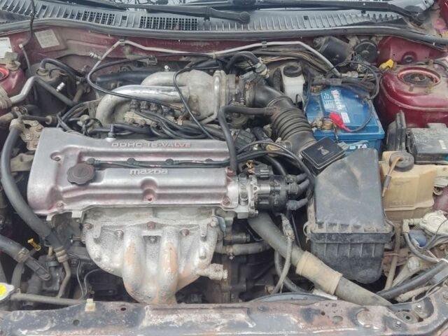 Красный Мазда 323, объемом двигателя 1.5 л и пробегом 367 тыс. км за 2400 $, фото 12 на Automoto.ua