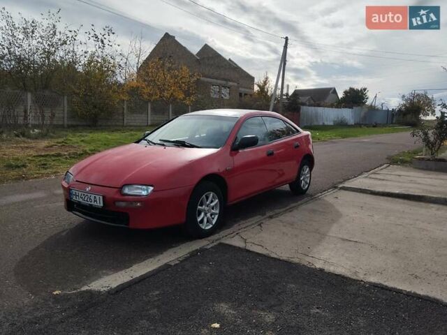 Красный Мазда 323, объемом двигателя 1.5 л и пробегом 258 тыс. км за 1600 $, фото 2 на Automoto.ua