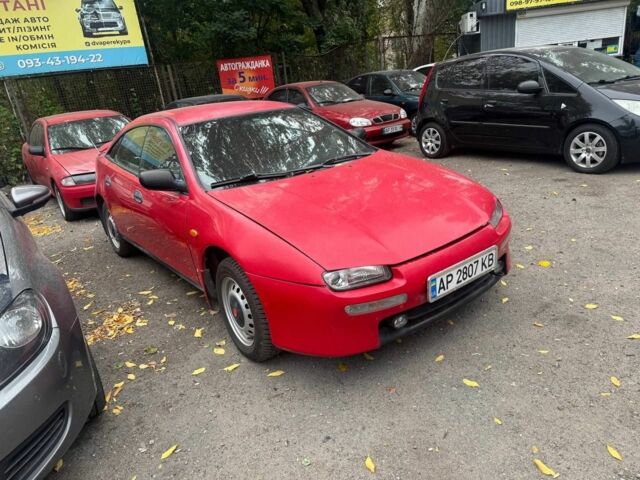 Красный Мазда 323, объемом двигателя 1.5 л и пробегом 150 тыс. км за 1500 $, фото 1 на Automoto.ua