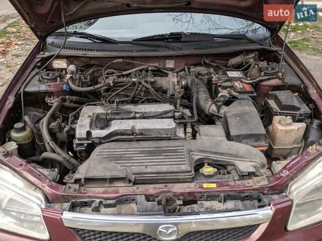 Красный Мазда 323, объемом двигателя 1.5 л и пробегом 487 тыс. км за 2250 $, фото 2 на Automoto.ua