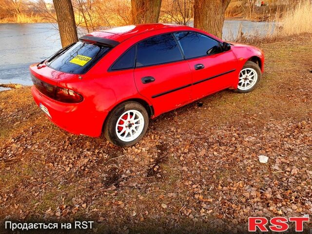 Красный Мазда 323, объемом двигателя 1.5 л и пробегом 38 тыс. км за 1900 $, фото 1 на Automoto.ua
