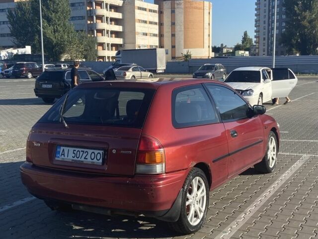 Красный Мазда 323, объемом двигателя 1.3 л и пробегом 300 тыс. км за 1000 $, фото 7 на Automoto.ua