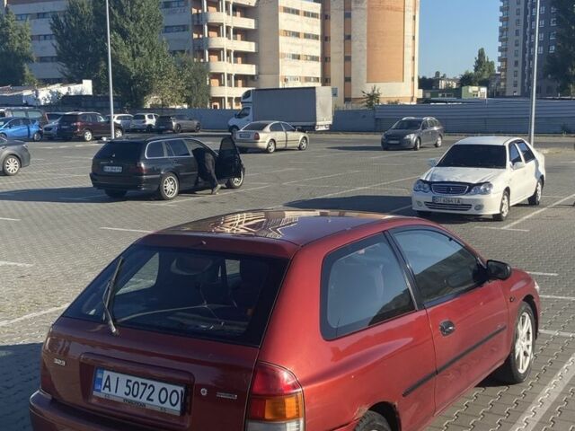 Красный Мазда 323, объемом двигателя 1.3 л и пробегом 300 тыс. км за 1000 $, фото 8 на Automoto.ua