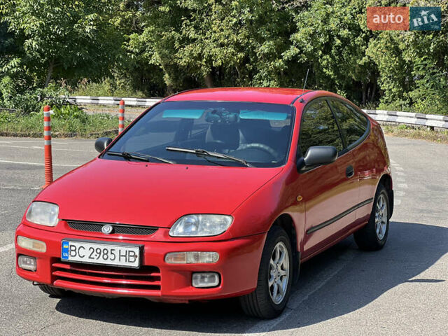 Червоний Мазда 323, об'ємом двигуна 1.5 л та пробігом 300 тис. км за 2299 $, фото 1 на Automoto.ua
