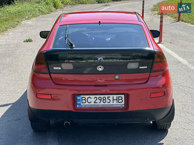 Червоний Мазда 323, об'ємом двигуна 1.5 л та пробігом 300 тис. км за 2299 $, фото 11 на Automoto.ua