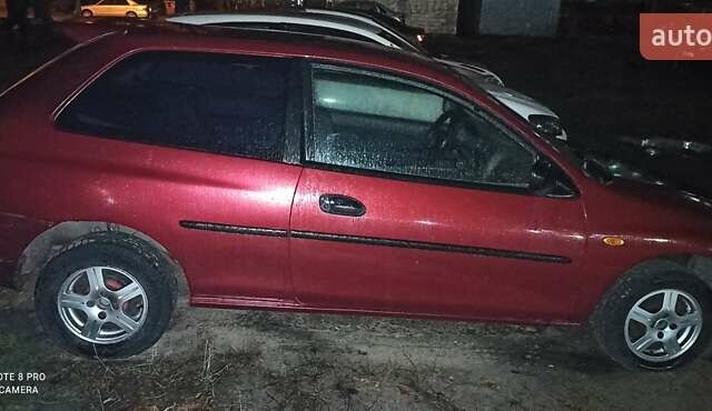 Красный Мазда 323, объемом двигателя 1.3 л и пробегом 250 тыс. км за 2500 $, фото 6 на Automoto.ua