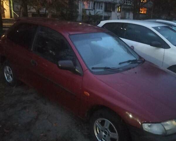 Красный Мазда 323, объемом двигателя 1.3 л и пробегом 250 тыс. км за 2500 $, фото 3 на Automoto.ua