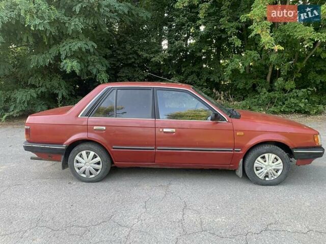 Червоний Мазда 323, об'ємом двигуна 1.3 л та пробігом 450 тис. км за 950 $, фото 6 на Automoto.ua
