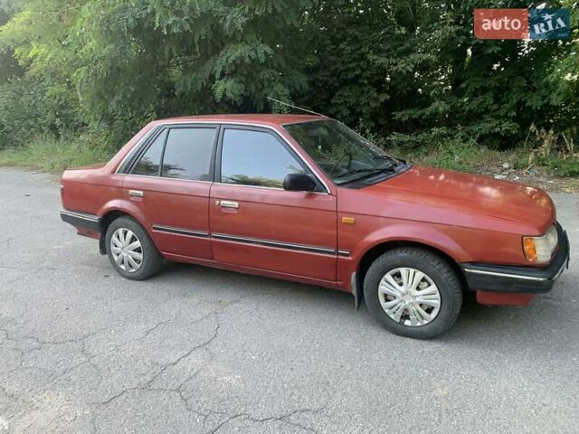 Червоний Мазда 323, об'ємом двигуна 1.3 л та пробігом 450 тис. км за 950 $, фото 7 на Automoto.ua